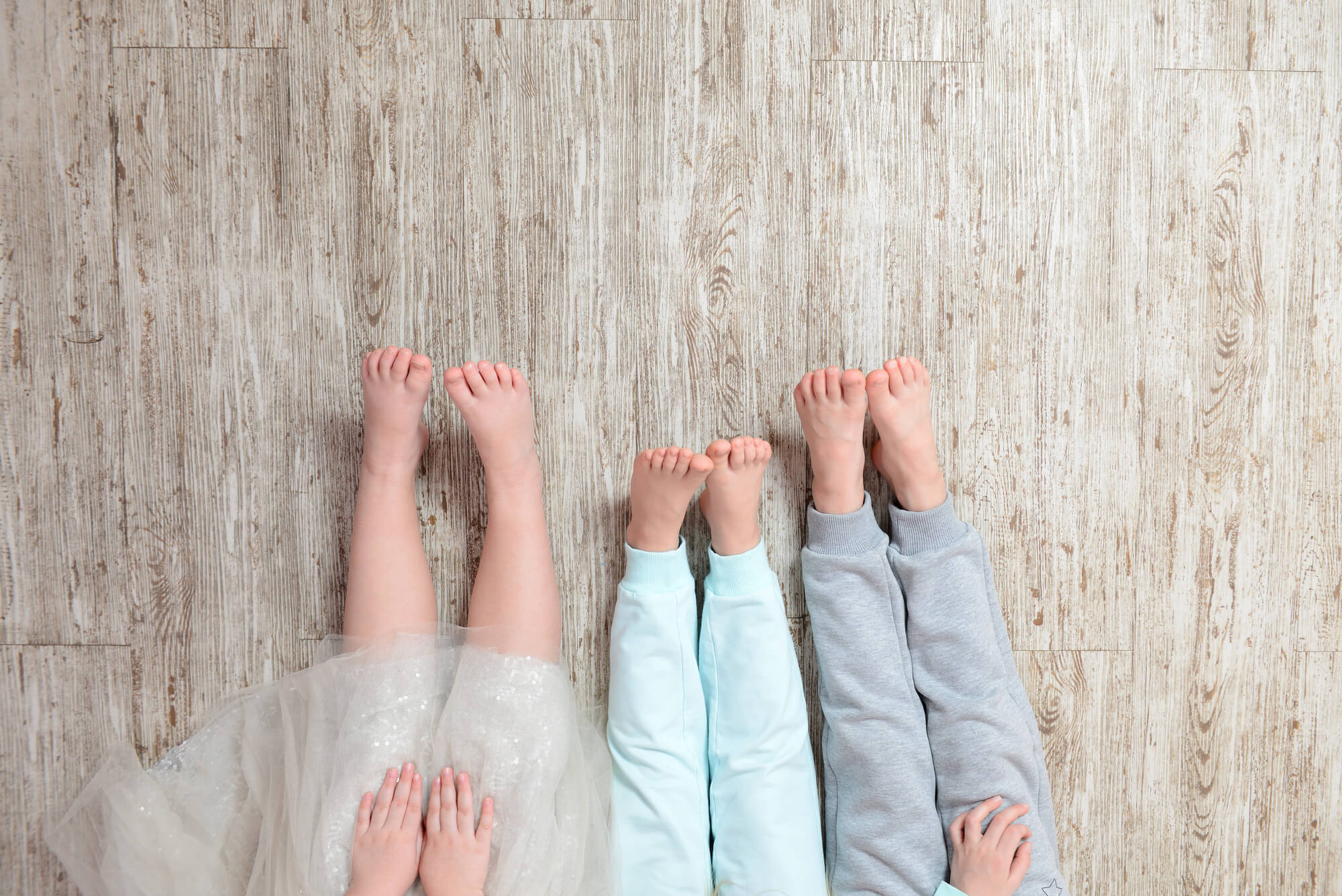 Children feet on a wooden floor