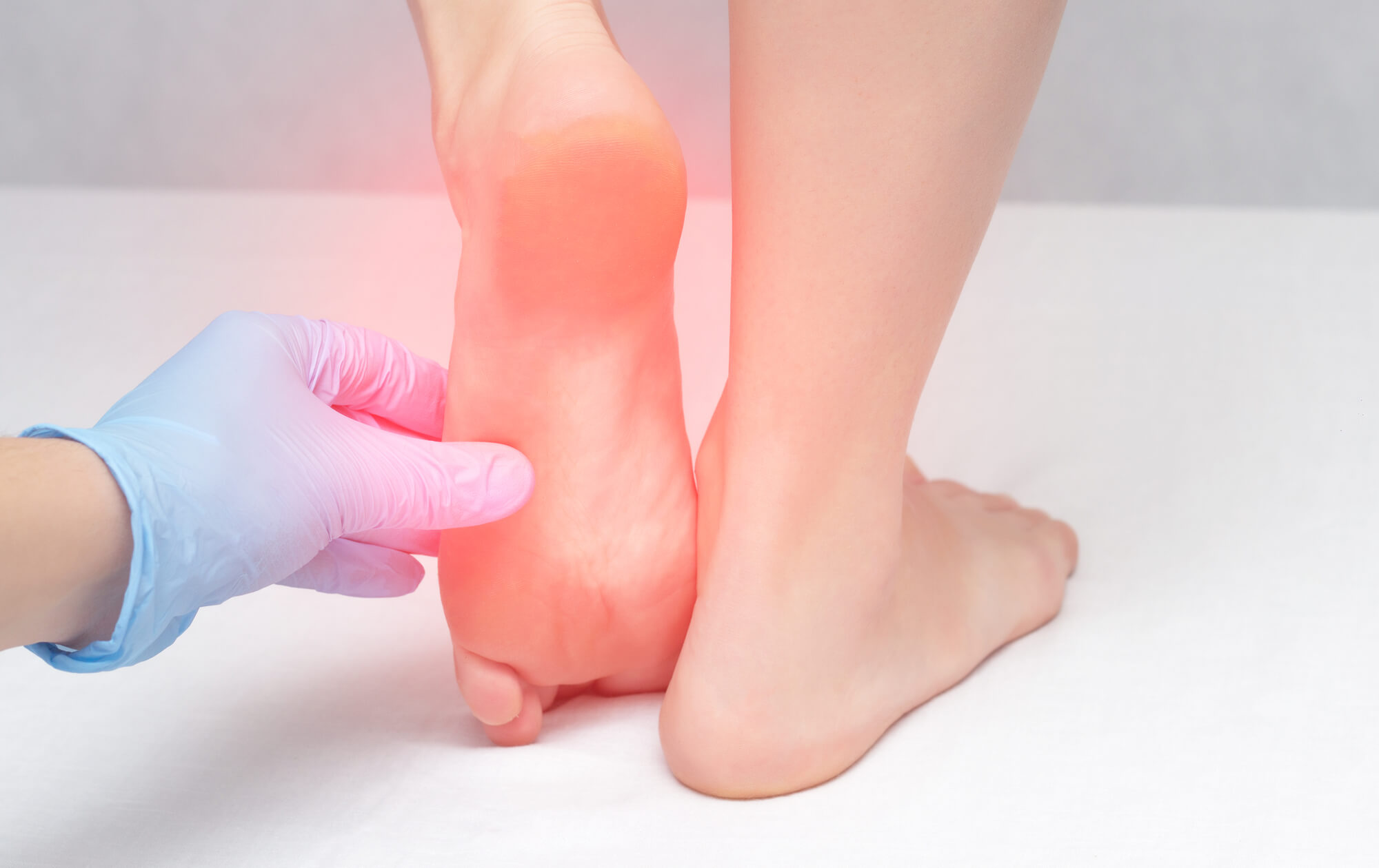 Doctor examines patient's feet